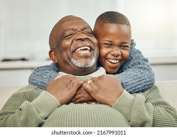 My boy, from my boy. Shot of a grandfather bonding with his young grandson on a sofa at home.