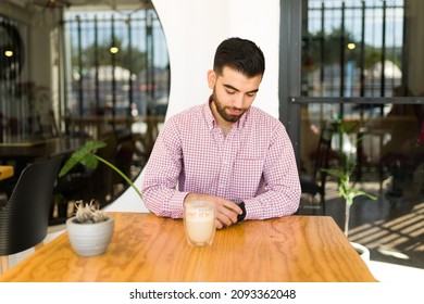 My Date Is Late. Sad Man Looking At The Watch And Waiting For His Date Who Stood Him Up At The Restaurant 