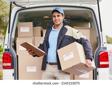 My Deliveries Are All Running On Schedule. Portrait Of A Delivery Man Unloading Boxes From His Van.