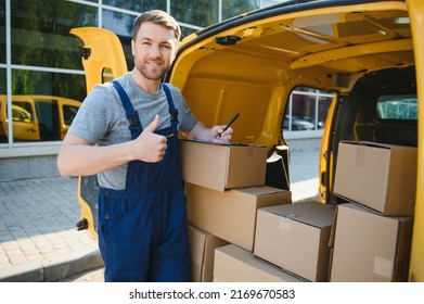 My Deliveries Are All Running On Schedule. Portrait Of A Delivery Man Unloading Boxes From His Van