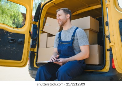 My Deliveries Are All Running On Schedule. Portrait Of A Delivery Man Unloading Boxes From His Van