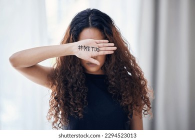 My experience shouldnt be a common issue. Shot of an unrecognisable woman with the hashtag me too written on her hand.