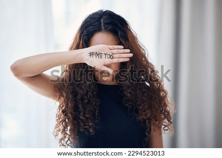My experience shouldnt be a common issue. Shot of an unrecognisable woman with the hashtag me too written on her hand.