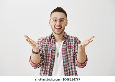 My Friend I Am Glad To See You. Young Attractive Sportsman With Stylish Haircut In Glasses Pulling Hands Towards Camera And Directing At Someone While Being Happy And Excited, Cheering Best Friend