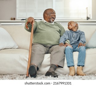 My grandpas the coolest. Shot of a grandfather bonding with his young grandson on a sofa at home.