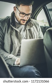 My Job Is Always With Me. Business Man Sitting In Car And Working On Laptop. Close Up.