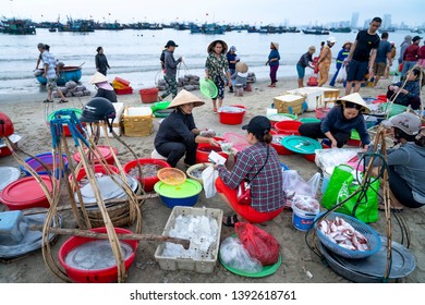 My Khe beach, Da Nang City, Vietnam - April 27, 2019: A fishing market at dawn when people busily sorting, buying and selling fresh fish in lively view