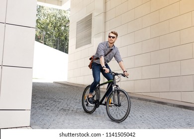 My Lifestyle. Positive Handsome Man Smiling While Riding On His Bike To Work