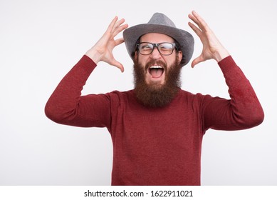 My Mind Has Been Blown Away Gesture Is Made By A Bearded Man Wearing Glasses And A Hat.