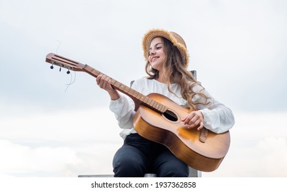 my new song. singer. happy teen girl playing guitar outdoor. happy childhood. - Powered by Shutterstock