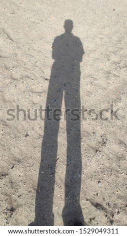 Similar – Shadow of a woman on the beach