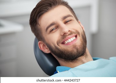 My Smile Is Perfect! Portrait Of Happy Patient In Dental Chair.