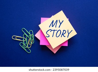 My story symbol. Orange steaky note with words My story. Beautiful deep blue background. Business and My story concept. Copy space. - Shutterstock ID 2395087039