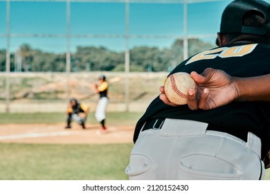 My Team Game To Win. Rearview Shot Of A Baseball Player Holding The Ball Behind His Back.