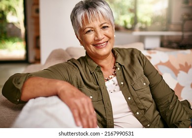 Its my time to relax. Portrait of a happy older woman relaxing on the sofa at home. - Powered by Shutterstock