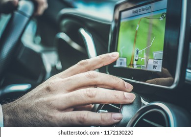 My Way To Work. Close Up Of Driver Hand Using Touch Screen In Car.