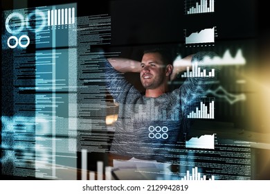 My Work Here Is Done. Shot Of A Smiling Computer Programmer Working At His Computer Late At Night.