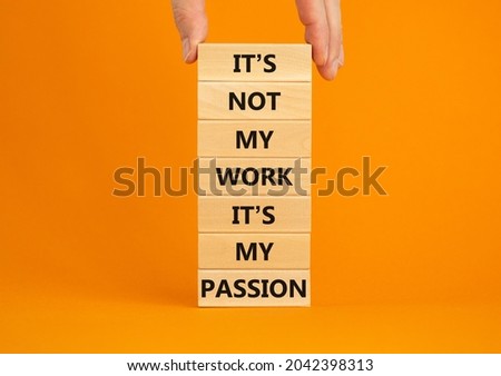 My work or passion symbol. Businessman hand. Wooden blocks with words 'It is not my work, it is my passion'. Beautiful orange background, copy space. Business and my work or passion concept.