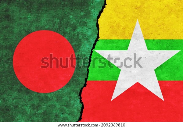 Myanmar and Bangladesh painted\
flags on a wall with a crack. Myanmar and Bangladesh relations.\
Myanmar and Bangladesh flags together. Myanmar vs\
Bangladesh
