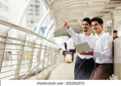 Myanmar Peoples Talking Business In City Using Wireless Technology