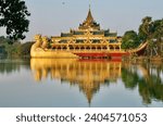 Myanmar Yangon Karaweik Hall on Kandawgyi Lake Reflection at Dusk