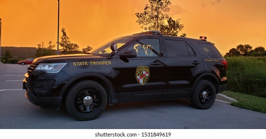 Myersville,Maryland/USA-08/18/2019: Maryland State Police Vehicle Before A Storm(Sun Shining Through Clouds)