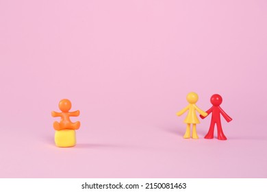 MYKOLAIV, UKRAINE - JANUARY 04, 2022: Colorful Human Figures On Pink Background, Space For Text. Surrogacy Concept