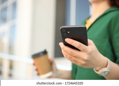 MYKOLAIV, UKRAINE - MARCH 16, 2020: Woman Holding IPhone 11 Black Outdoors, Closeup