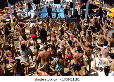 Mykonos / Greece - 08/22/2019: Crowd Of Passengers Dancing During A Pool Party On Board A Cruise Ship