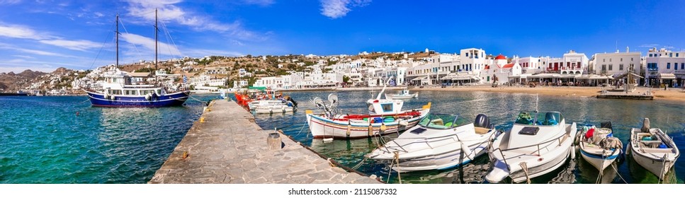 Mykonos island. Greece summer holidays. Panorama of old port in downtown. view with boats bars and restaurants. Cyclades. 