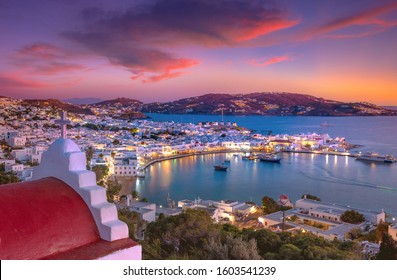Mykonos port with boats and windmills at evening, Cyclades islands, Greece