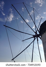 Mykonos Windmill Against Blue Sky With Small White Clouds