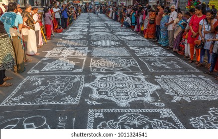 Mylapore,Chennai,India Jan 07 2018: Indian traditional kolam (in tamil language) or rangoli is drawn using white colored rice during festival season 7