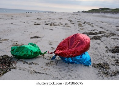 Mylar Balloons Litter An Empty Beach