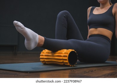 Myofascial release,Massaging fascia calf muscles with myofascial roll,fitness,self-care,health,smart fitness.Myofascial relaxationmuscles  foot with a massage ball mat at home,smart fitness,mfr - Powered by Shutterstock