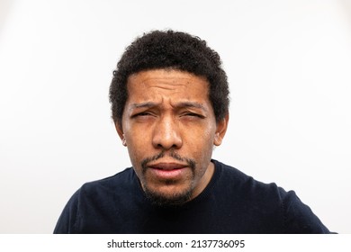 Myopic man without glasses straining his eyes because he can't see well. Squinting face and frowning expression. Isolated against white background - Shutterstock ID 2137736095