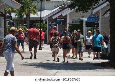 Myrtle Beach, SC - United States - 07-05-2021: Visitors Explore The Grounds Of Barefoot Landing On A Hot Day.