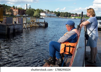 Myshkin, Russia - 26 July 2020, A Ferry Worker Is Waiting For The Ferry To Moor And Dock. The Passenger Is Waiting For The End Of The Trip.