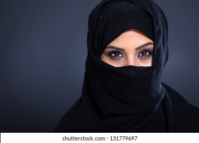 mysterious Arabian woman on black background