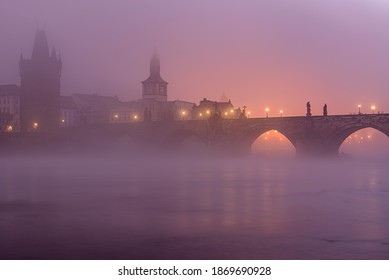 A mysterious autumn dawn at Charles Bridge covered in thick mist in historical center of Prague.  - Powered by Shutterstock