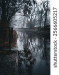 Mysterious autumn fog over the ancient canal in the city