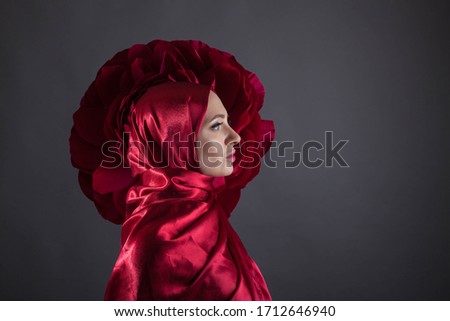 mysterious beautiful woman in the red silk dress of the Eastern Muslim peoples