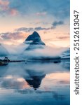 Mysterious landscape of Milford Sound or Rahotu with Mitre peak in foggy on the lake during the morning at Fiordland national park, New Zealand