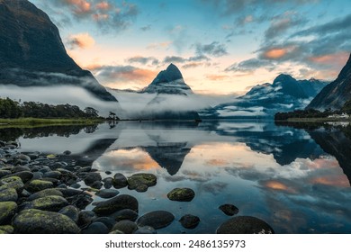 Mysterious landscape of Milford Sound or Rahotu with Mitre peak in foggy on the lake during the morning at Fiordland national park, New Zealand - Powered by Shutterstock