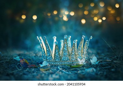 mysterious and magical photo of gold king crown in the England woods. Medieval period concept. - Shutterstock ID 2041105934