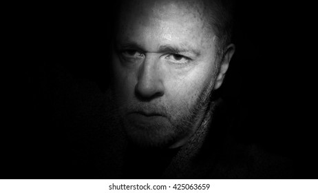 Mysterious Man In Shadows Suggesting Noir Film Or Photography.