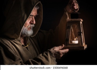 Mysterious Medieval Monk Lights Lantern