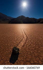 The Mysterious Moving Rocks Of The Race Track In Death Valley National Park Under A Full Moon. 