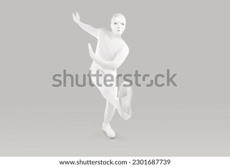Mysterious person dancing in monochromatic white, skin tight bodysuit. Full length man in white, skintight costume and creepy mask of anthropomorphic android robot dances on light grey background