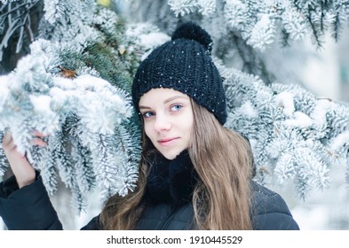 Mysterious Portrait Of A Woman In Winter, A Girl's Look Through Frosty Branches, Beautiful Eyes, Frosty Cold Day